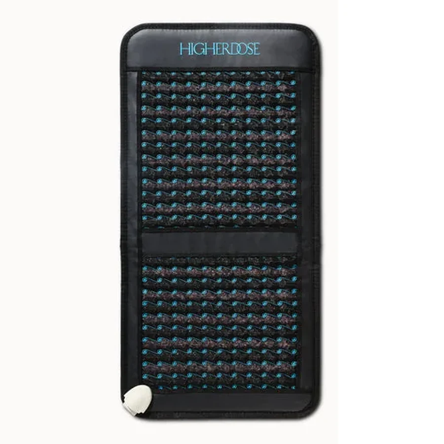 The HigherDOSE Infrared PEMF Go Mat, a folding black mat with an amethyst and tourmaline stone surface